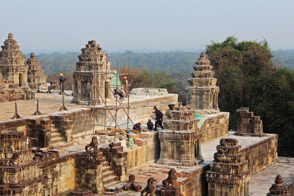 Workers restoring Phnom Bakheng