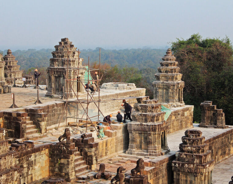 Workers restoring Phnom Bakheng