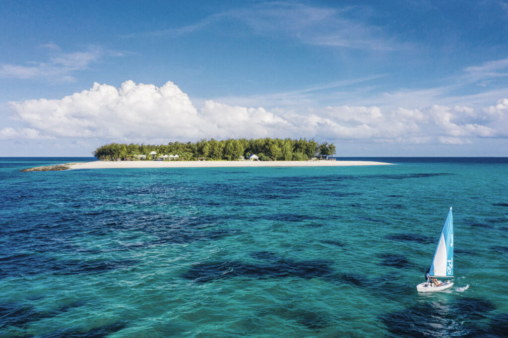 A sailing boat passing the island