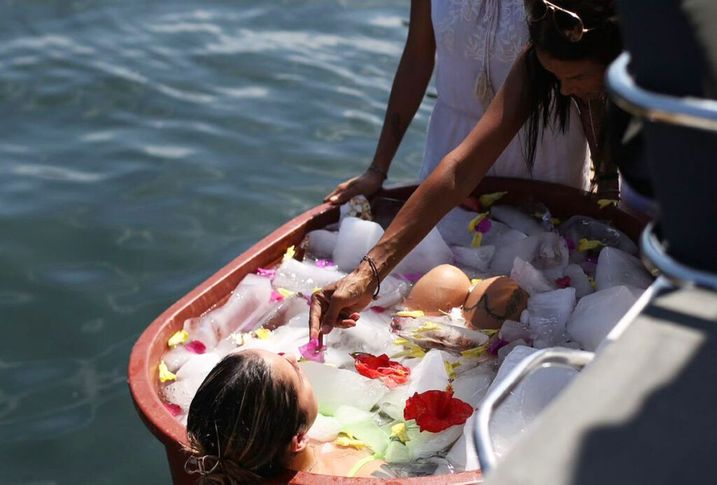 A female guest experiencing an ice bath