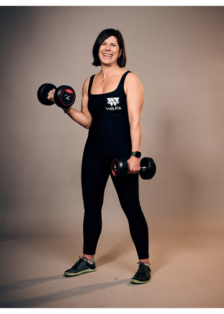 Ann working out with some dumbbells