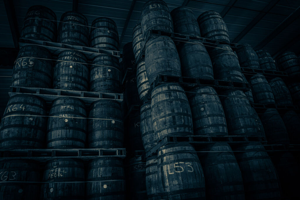 Many barrels on palettes stacked on top of each other