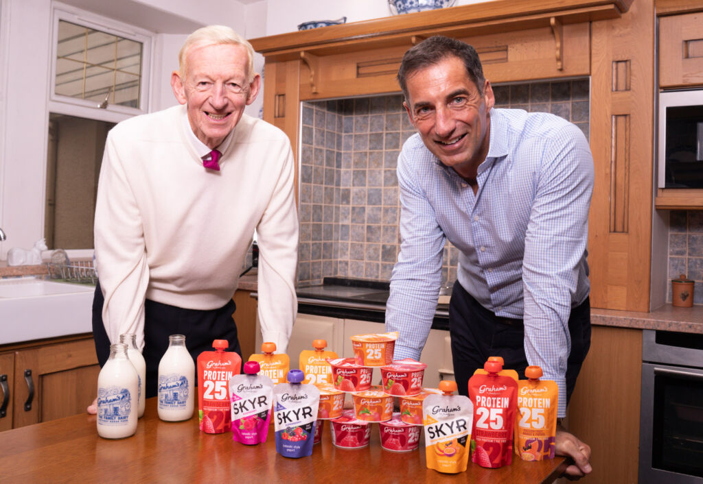 Ccmpany representatives with some of the dairy's products