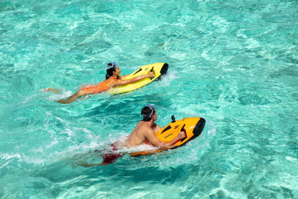 Guests exploring the clear waters with Seabobs