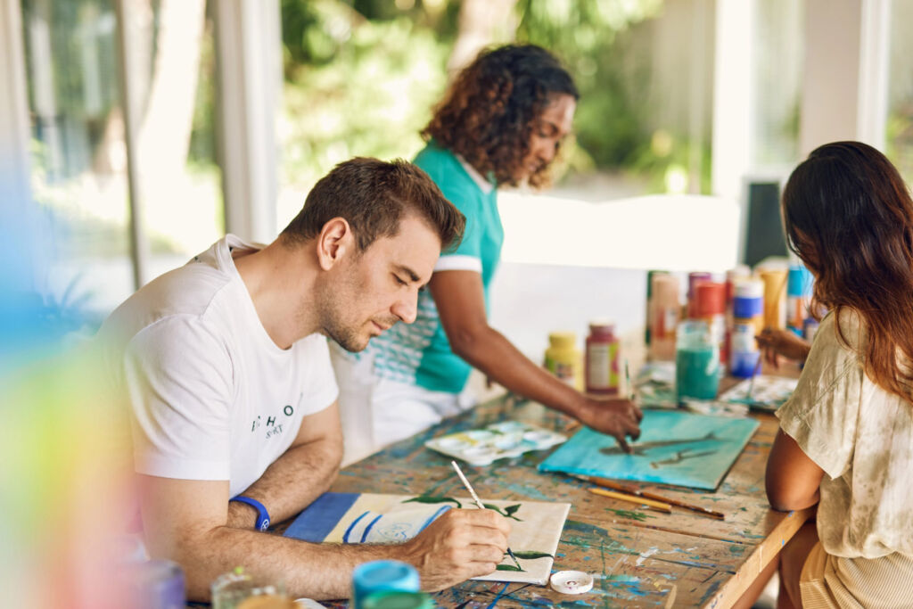 A family trying their hands at painting in the art studio