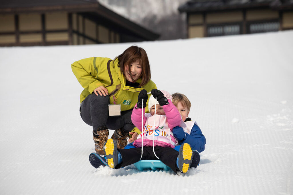 Children enjoying the snowy slopes