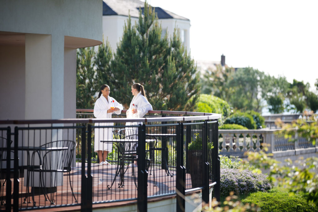 Guests talking on a balcony