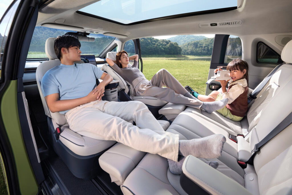 A family resting in their car